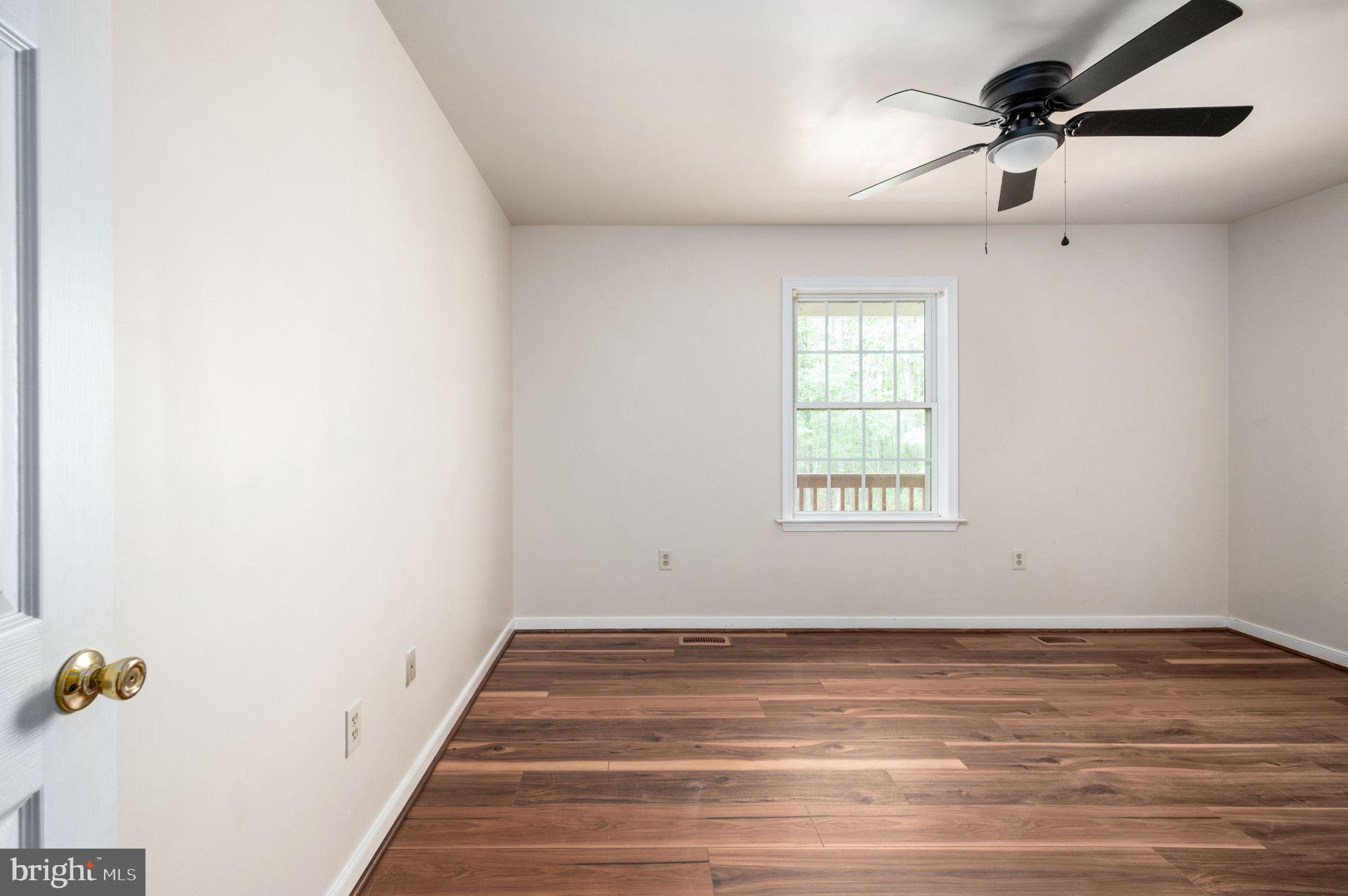 1822 Copper Line Road Bumpass, VA 23024 - Photo 32 of 65 a view of an empty room with a window