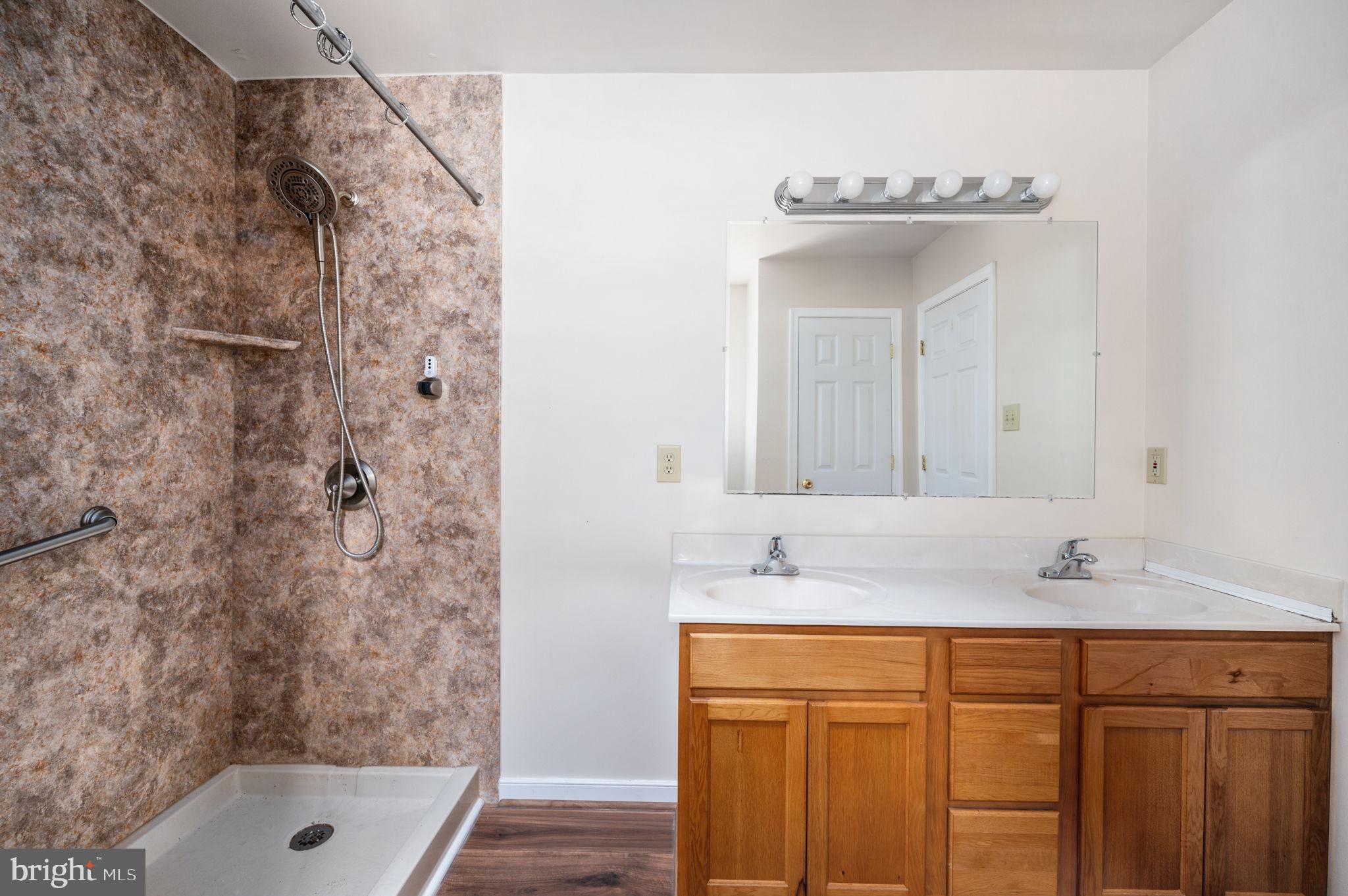 1822 Copper Line Road Bumpass, VA 23024 - Photo 40 of 65 a bathroom with a sink and a tub