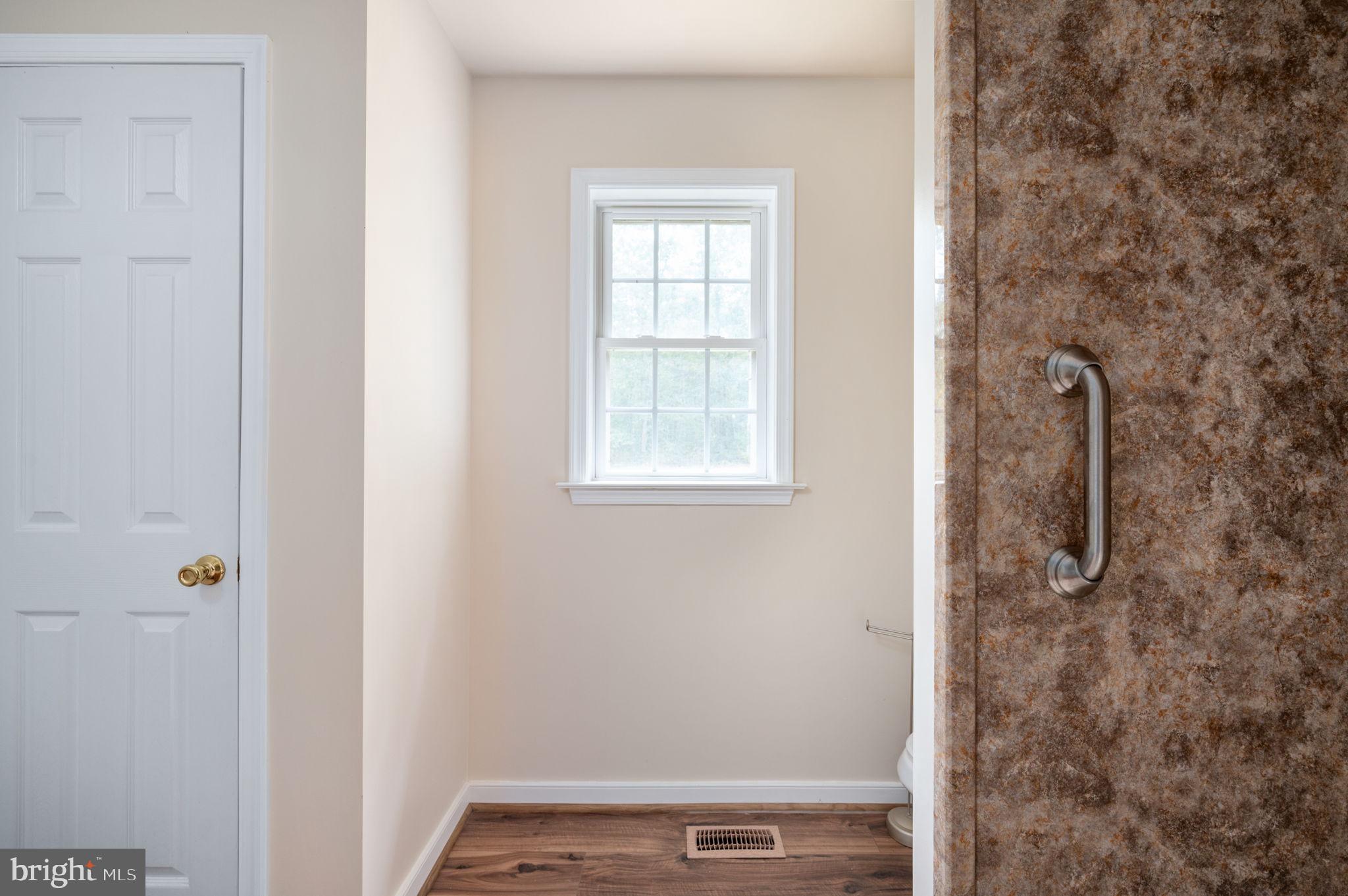 1822 Copper Line Road Bumpass, VA 23024 - Photo 41 of 65 a view of a bathroom with a window