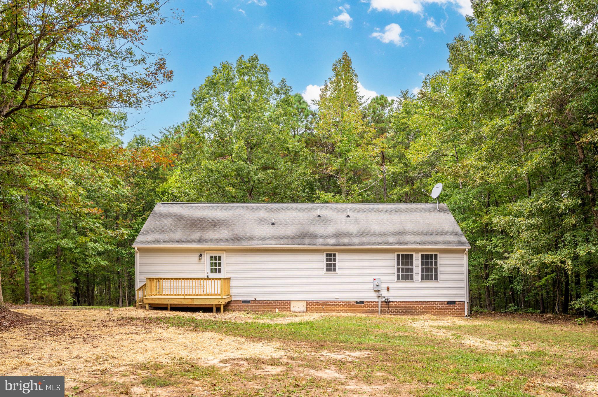 1822 Copper Line Road Bumpass, VA 23024 - Photo 45 of 65 a front view of a house with a yard
