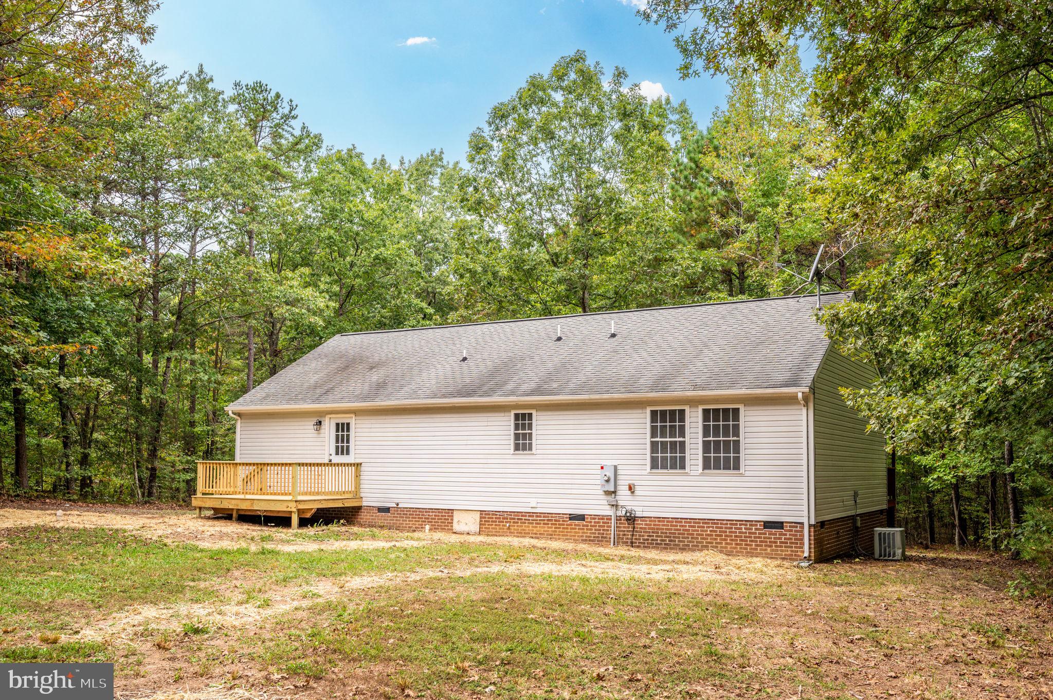 1822 Copper Line Road Bumpass, VA 23024 - Photo 46 of 65 a view of a house with a backyard