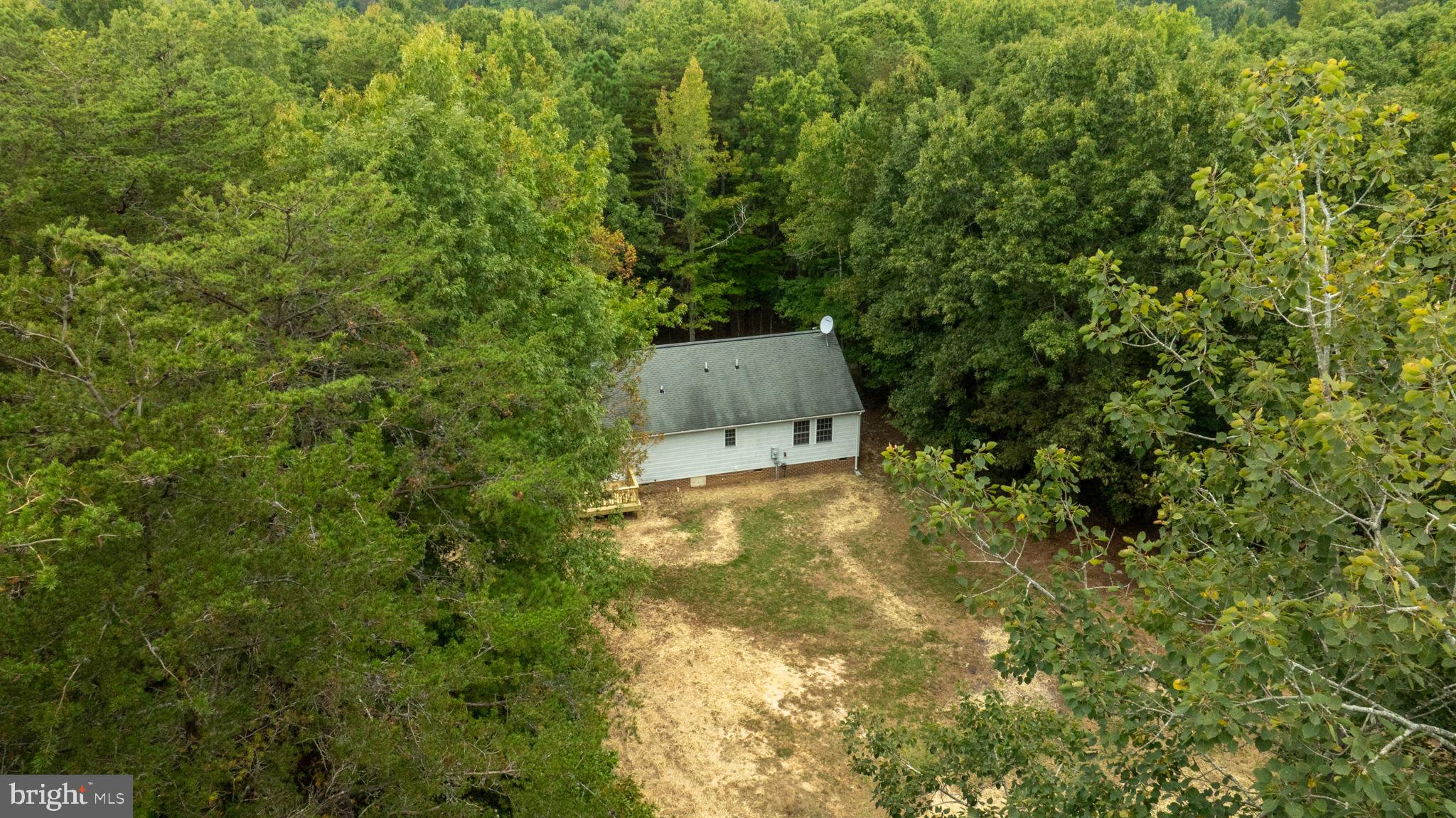 1822 Copper Line Road Bumpass, VA 23024 - Photo 50 of 65 an aerial view of a house with a yard