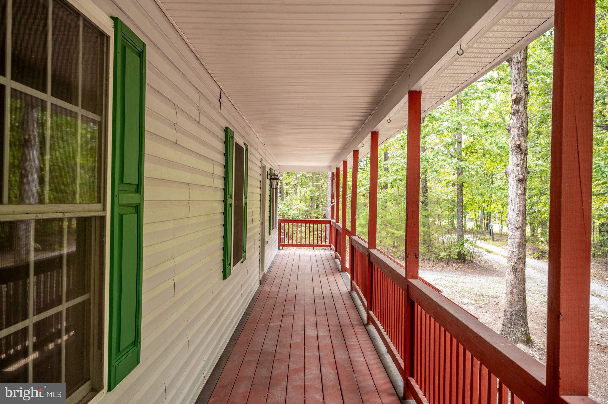 1822 Copper Line Road Bumpass, VA 23024 - Photo 6 of 65 a view of a balcony with wooden floor