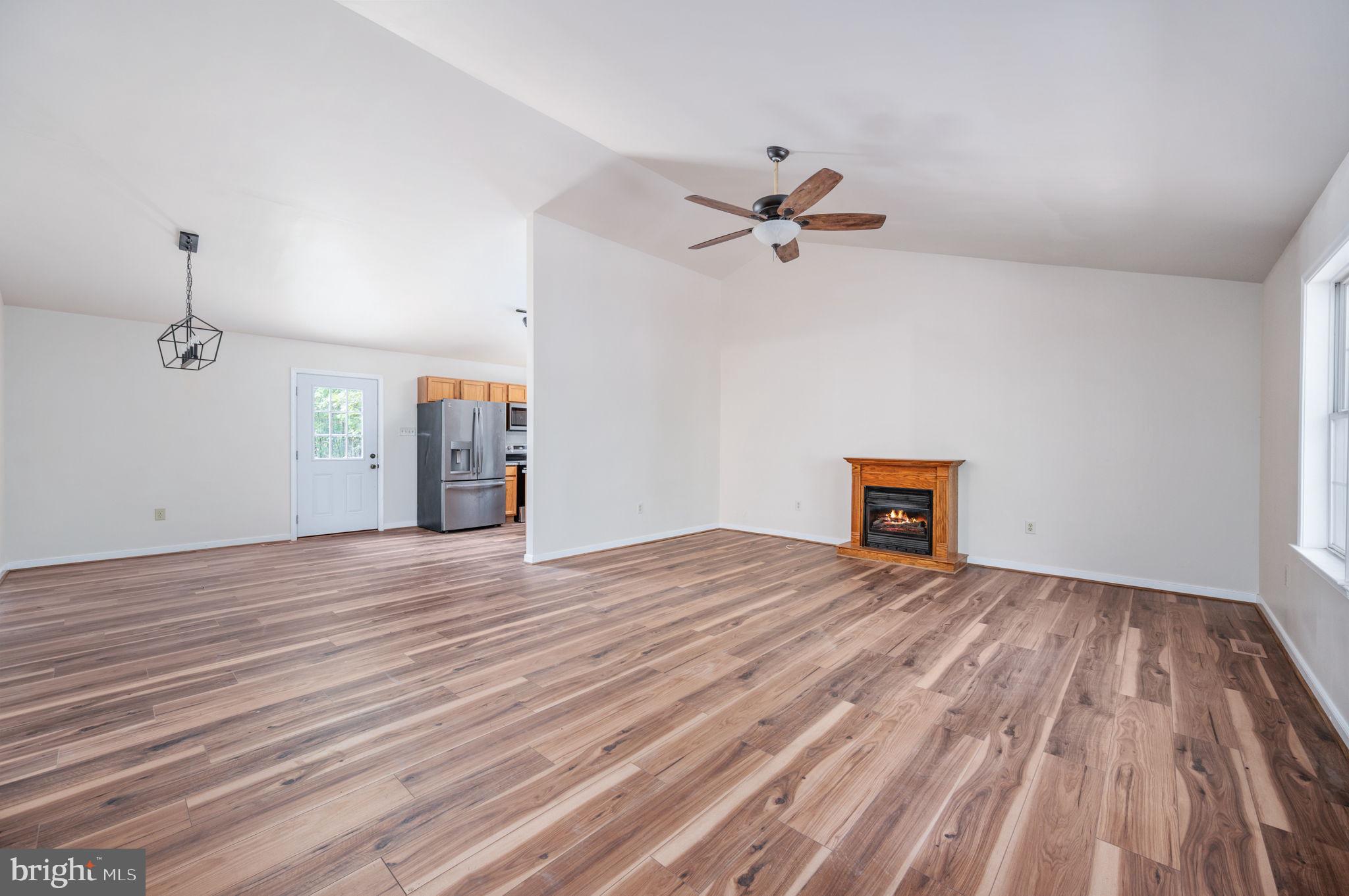 1822 Copper Line Road Bumpass, VA 23024 - Photo 9 of 65 a view of empty room with wooden floor