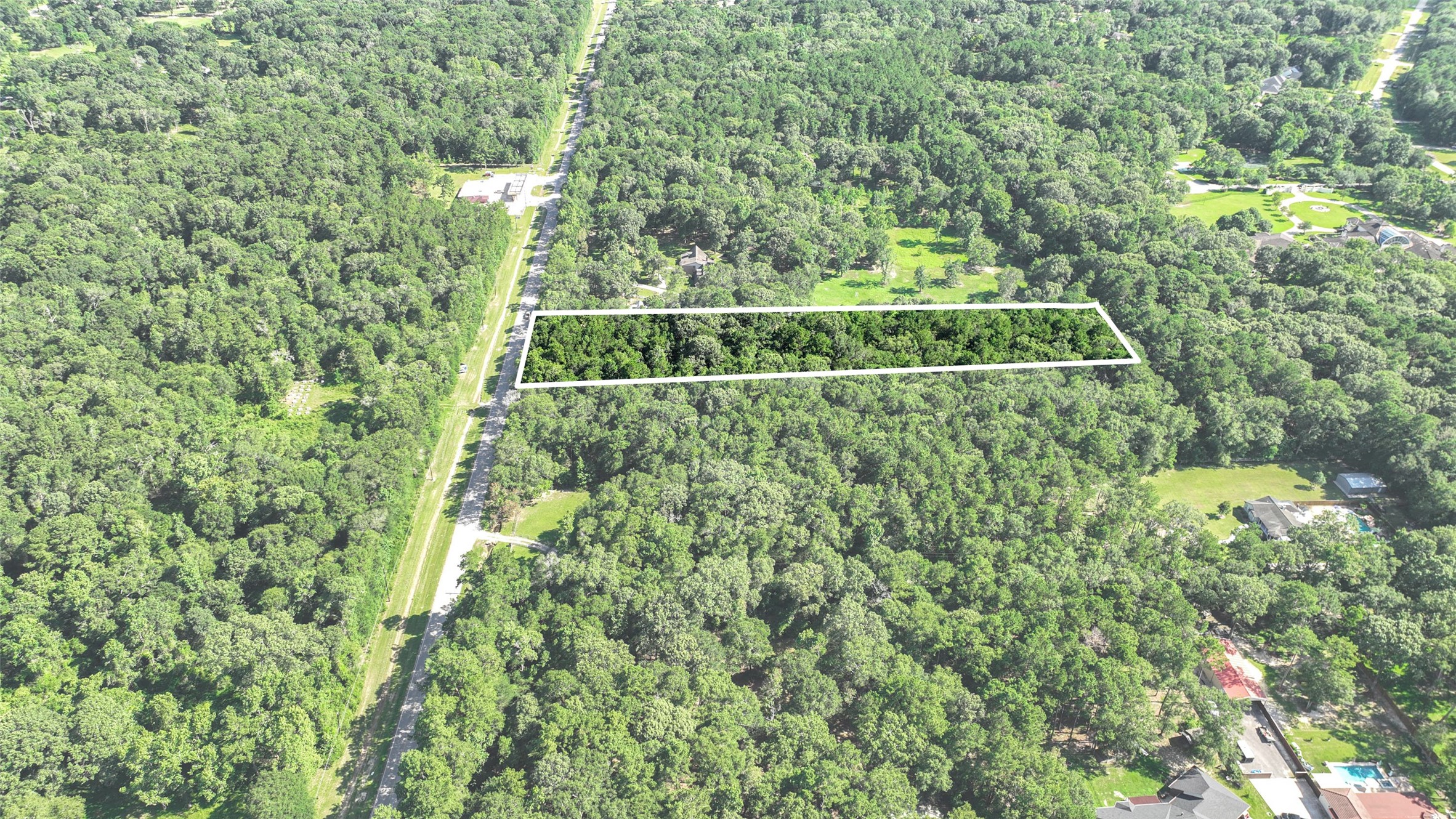 29811 Huffman Cleveland Road Huffman, TX 77336 - Photo 16 of 20 a view of a green yard