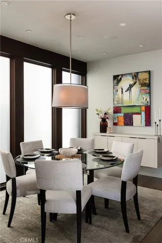 a kitchen with a table and chairs in it