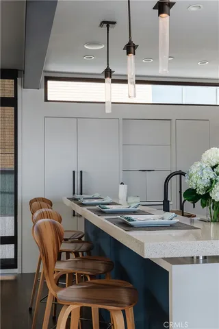 a kitchen with a table and chairs