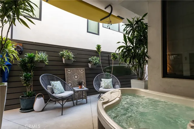 a living room with furniture and a lamp