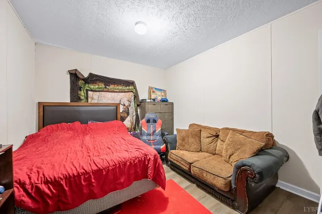 a bedroom with a bed and dresser