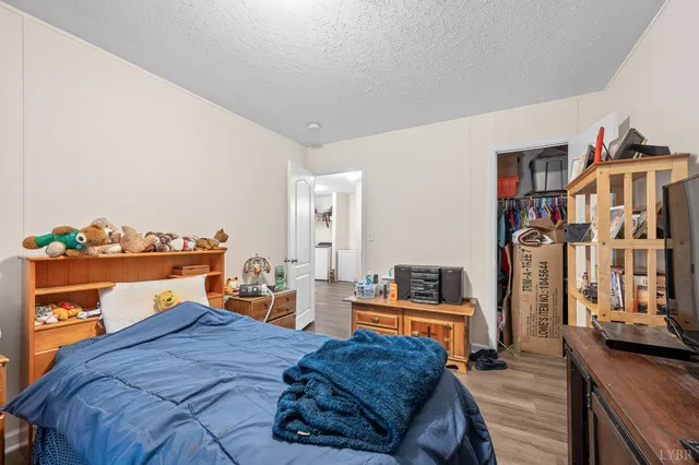 a bedroom with furniture and a book shelf