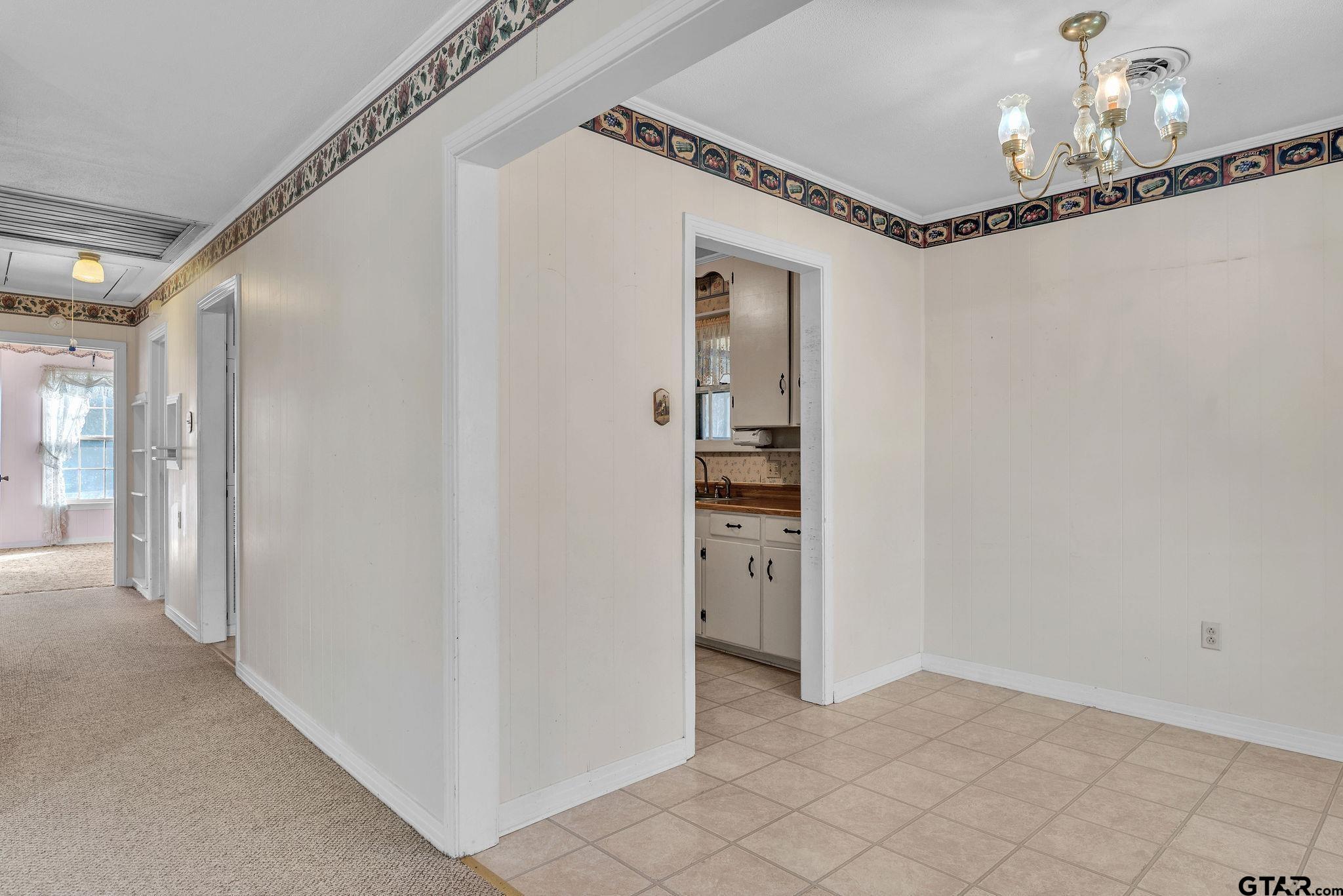 501 Samuel Street Marshall, TX 75672 - Photo 4 of 41 a view of a hallway with wooden floor