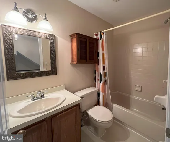 a bathroom with a sink toilet tub and shower