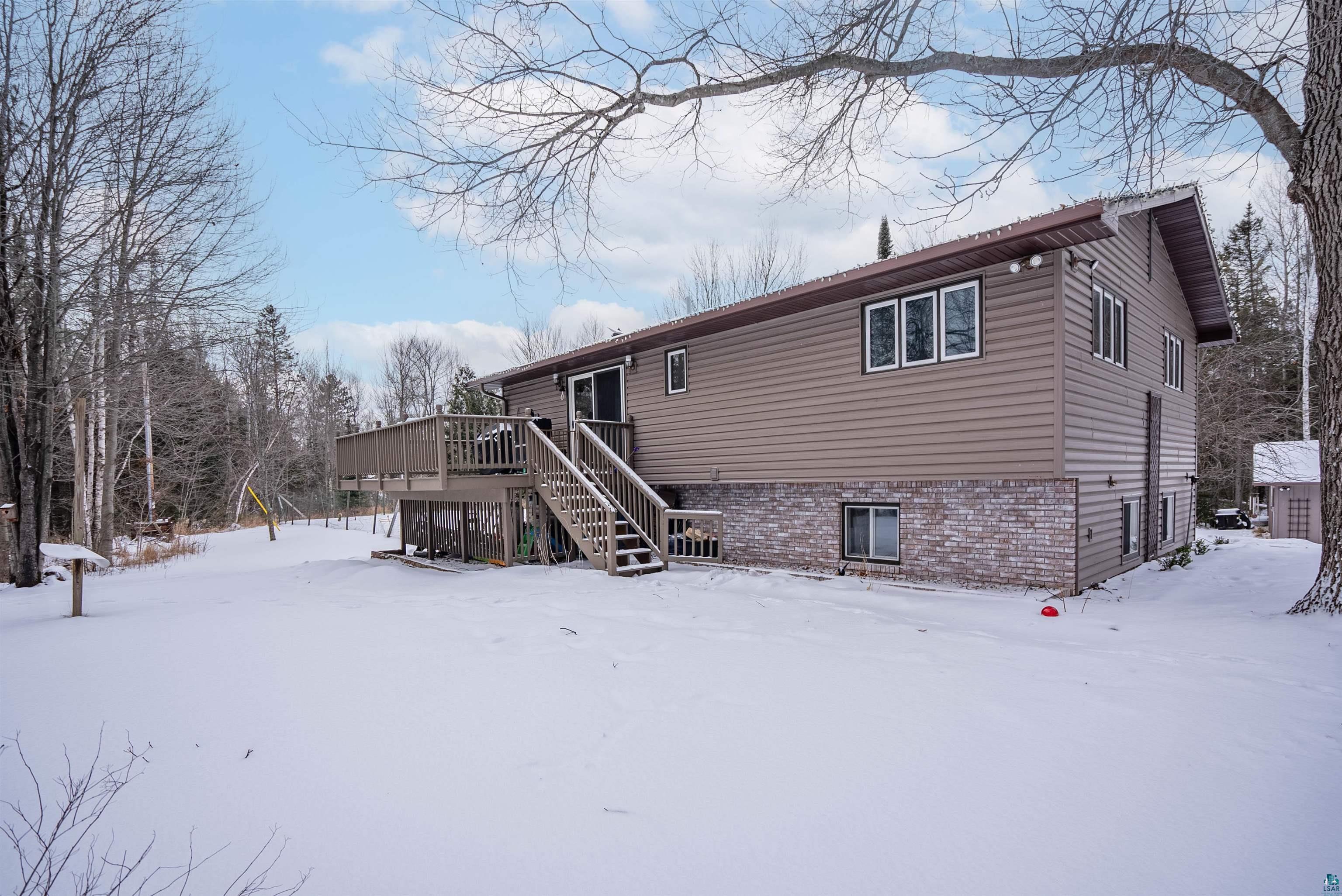 6949 County Rd A Superior, WI 54880 - Photo 23 of 34 Snow covered property with a deck