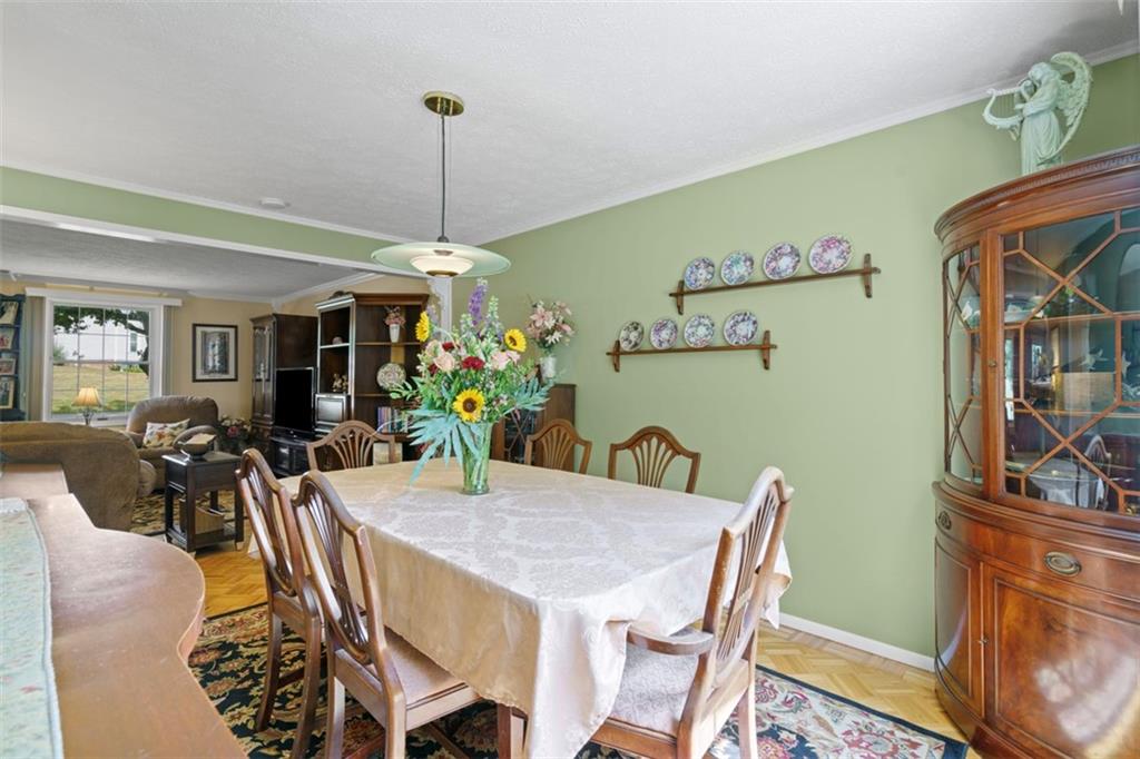 274 Kettering Circle Gibsonia, PA 15044 - Photo 11 of 50 a view of a dining room with furniture window and wooden floor
