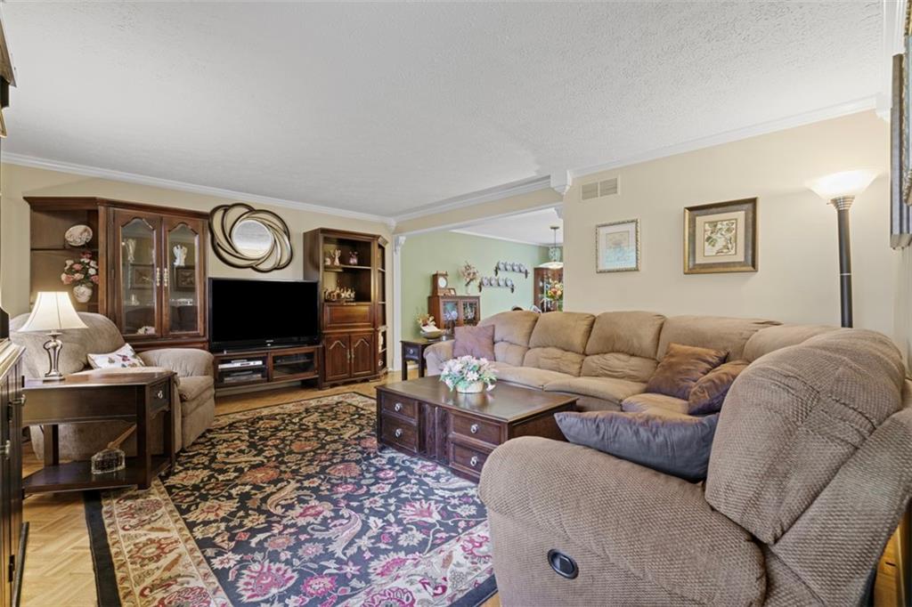 274 Kettering Circle Gibsonia, PA 15044 - Photo 13 of 50 a living room with furniture a flat screen tv and a fireplace