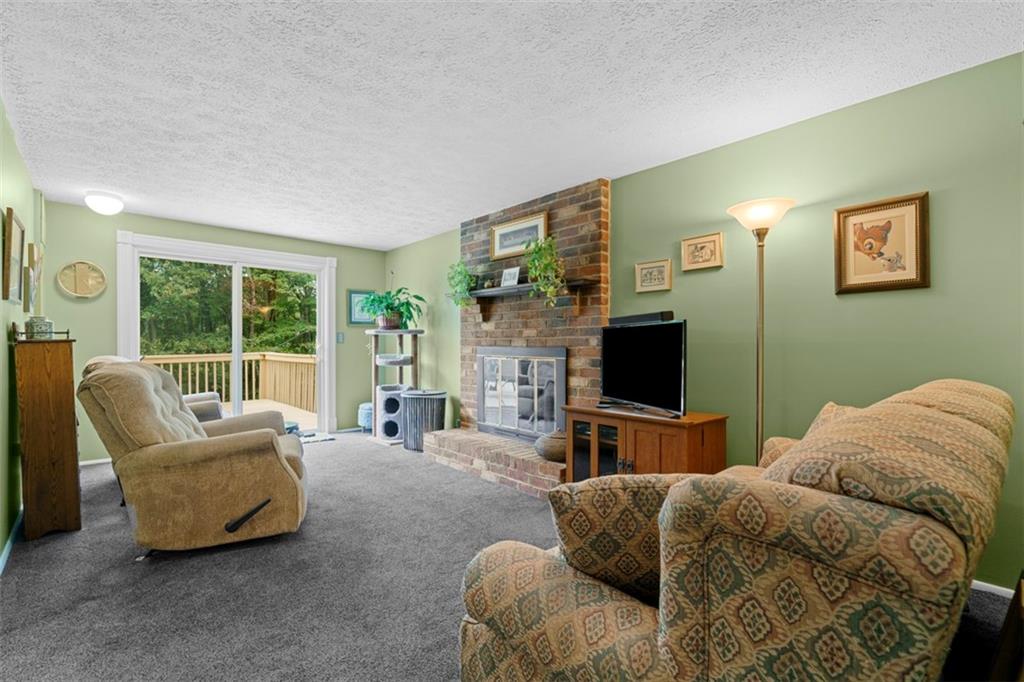 274 Kettering Circle Gibsonia, PA 15044 - Photo 15 of 50 a living room with furniture and a flat screen tv