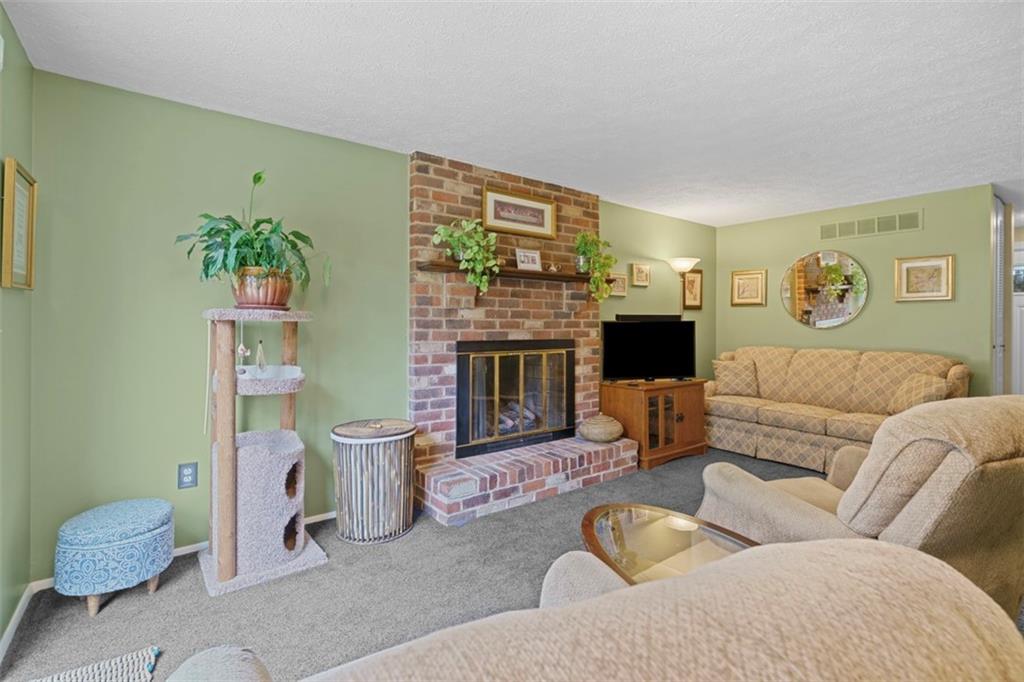 274 Kettering Circle Gibsonia, PA 15044 - Photo 16 of 50 a living room with furniture and a fireplace