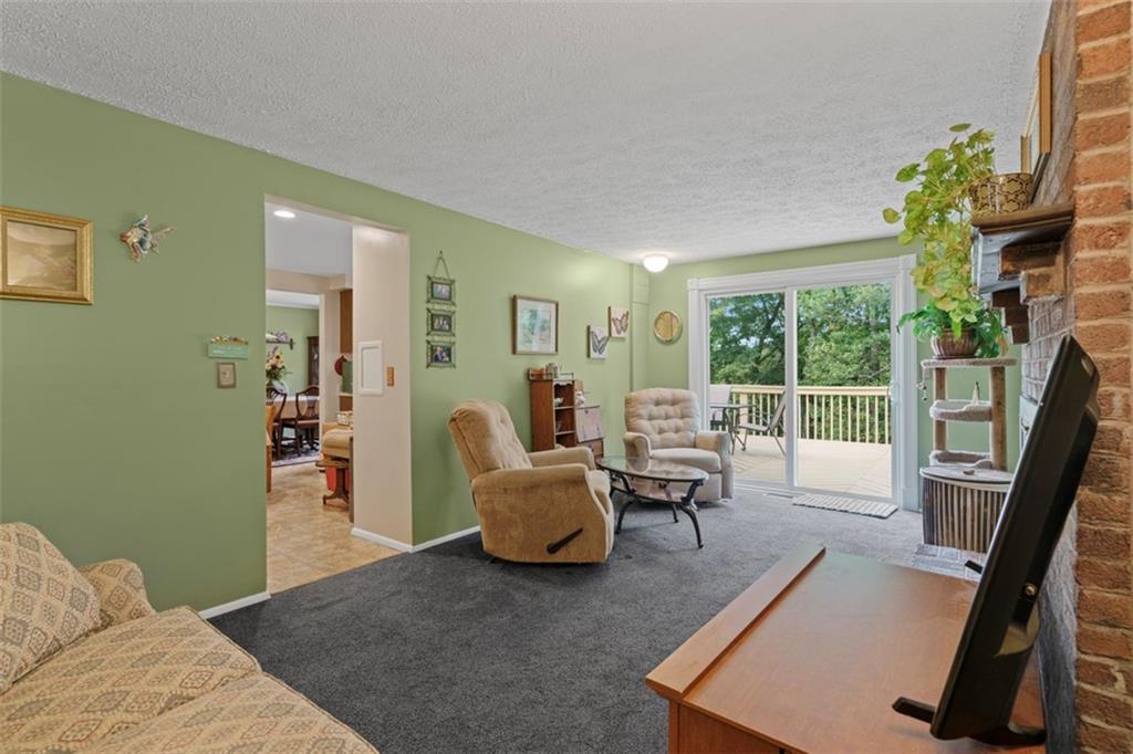 274 Kettering Circle Gibsonia, PA 15044 - Photo 17 of 50 a living room with furniture and a large window