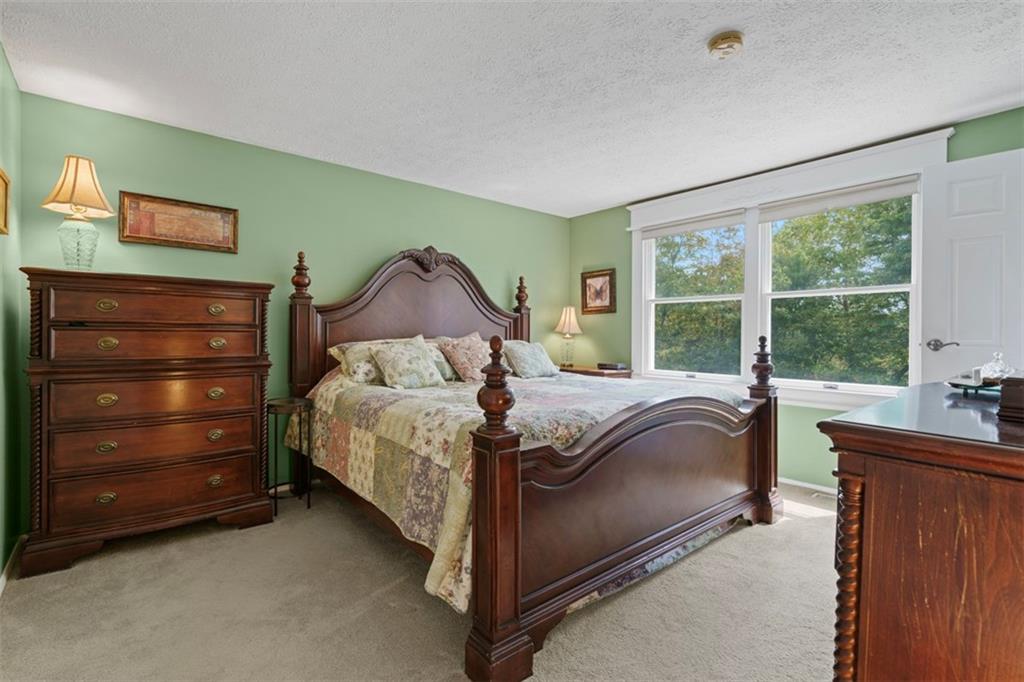 274 Kettering Circle Gibsonia, PA 15044 - Photo 19 of 50 a bedroom with a bed and a table