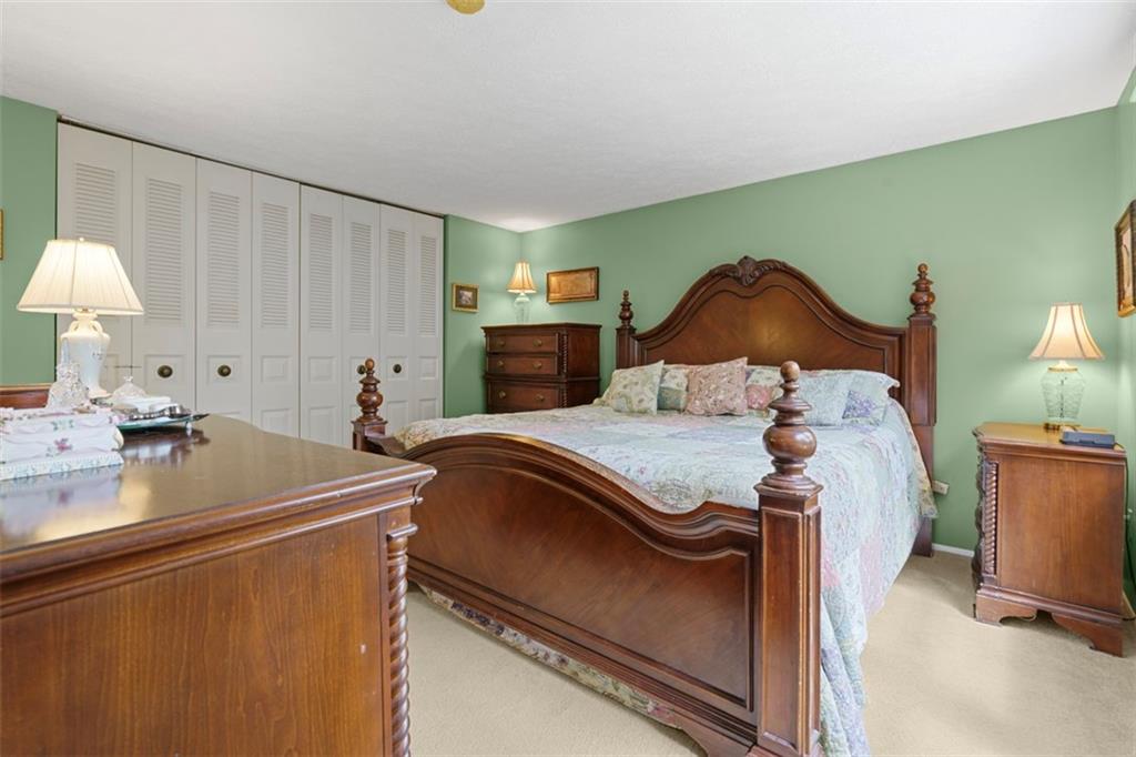 274 Kettering Circle Gibsonia, PA 15044 - Photo 20 of 50 a bedroom with a bed and a chandelier