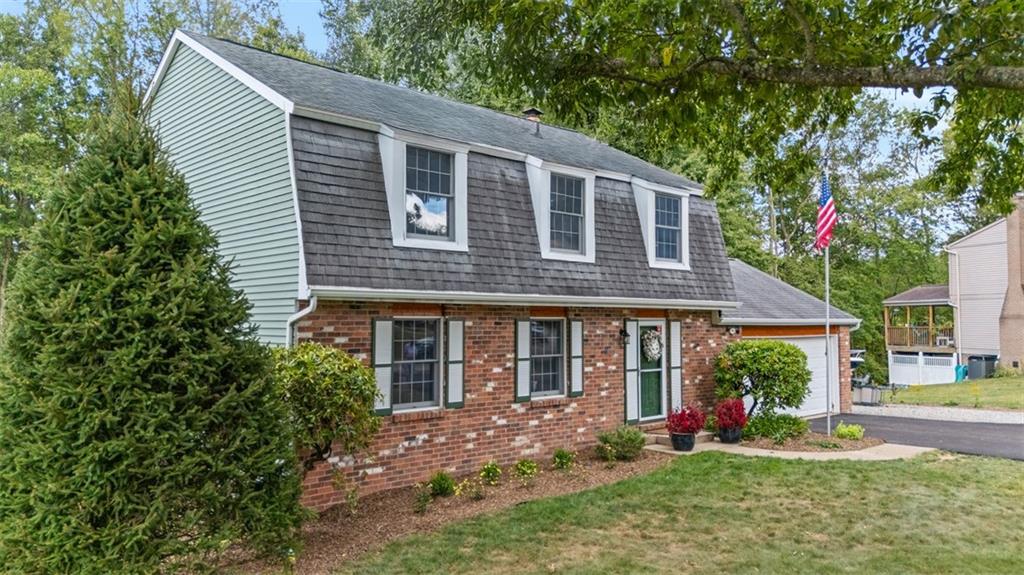 274 Kettering Circle Gibsonia, PA 15044 - Photo 2 of 50 a front view of a house with a yard and porch