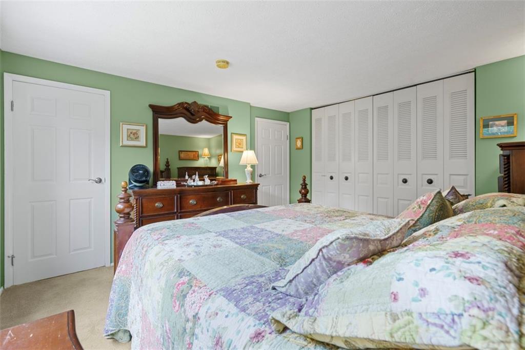 274 Kettering Circle Gibsonia, PA 15044 - Photo 21 of 50 a bedroom with a bed and a mirror