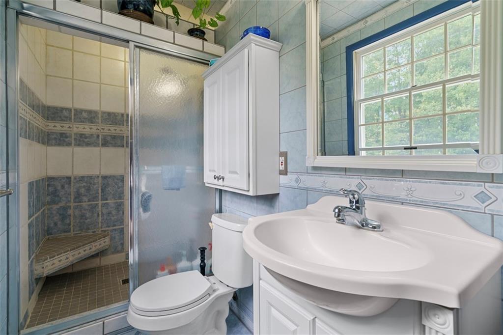 274 Kettering Circle Gibsonia, PA 15044 - Photo 22 of 50 a bathroom with a sink toilet and shower