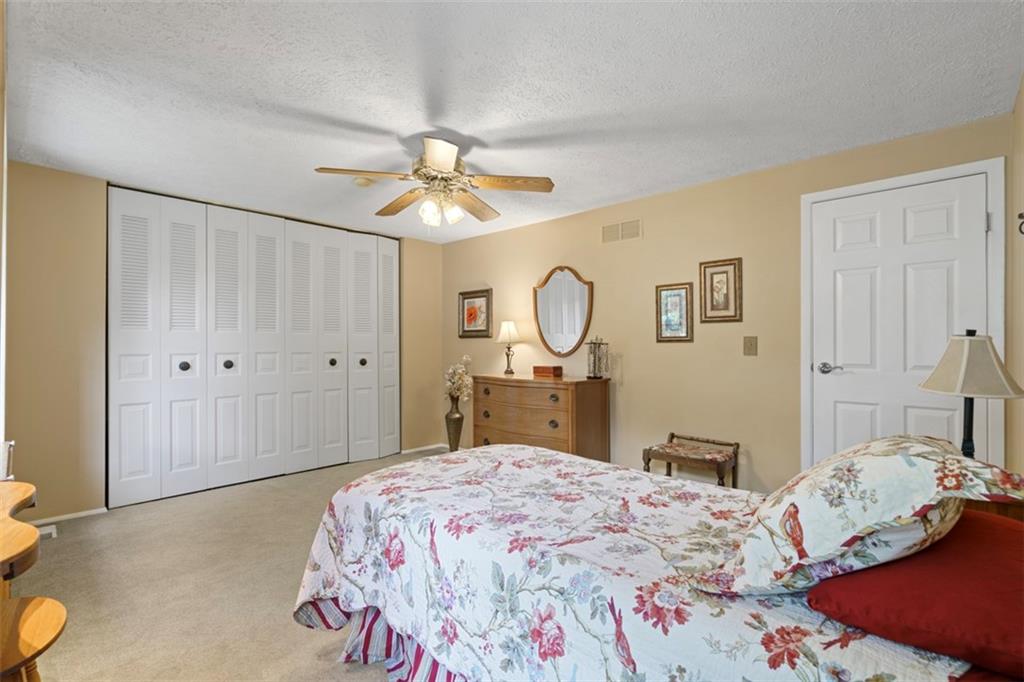 274 Kettering Circle Gibsonia, PA 15044 - Photo 25 of 50 a bedroom with a bed and cabinets
