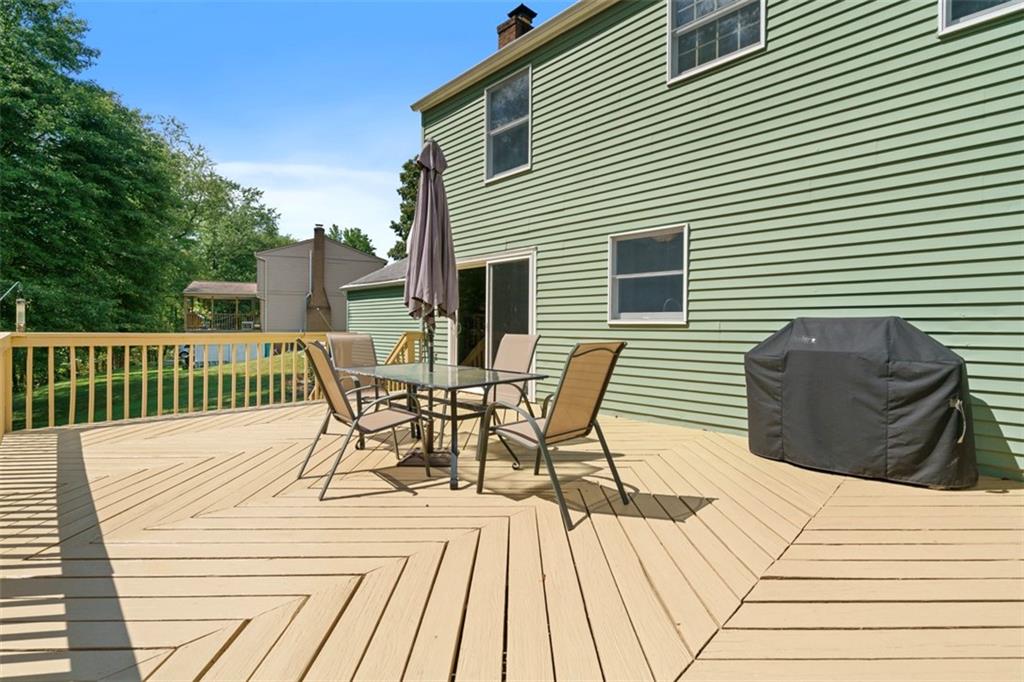274 Kettering Circle Gibsonia, PA 15044 - Photo 41 of 50 a view of a roof deck with table and chairs and wooden floor