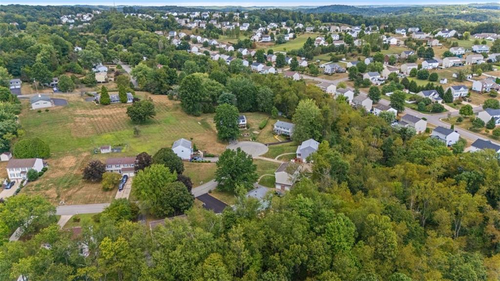274 Kettering Circle Gibsonia, PA 15044 - Photo 50 of 50 an aerial view of green landscape with trees houses and lake view