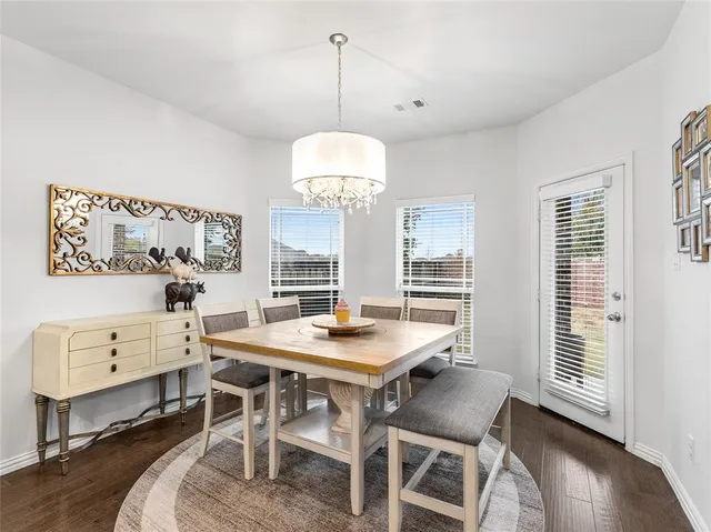 a kitchen with a sink stainless steel appliances and cabinets