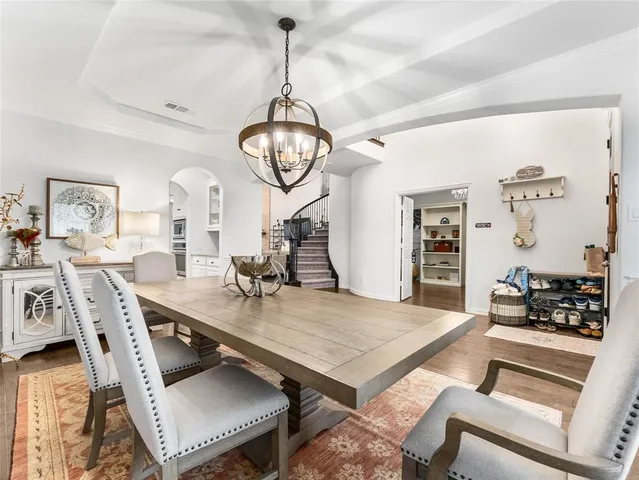 a living room with furniture a rug and a window