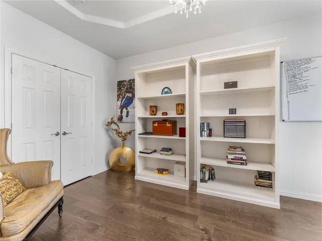 a view of a livingroom with workspace and a window