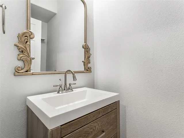 a living room with furniture and a bookshelf