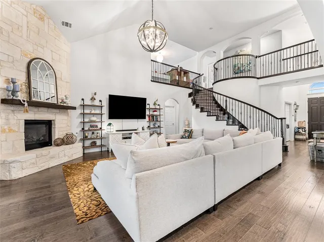 a living room with furniture flat screen tv and a fireplace