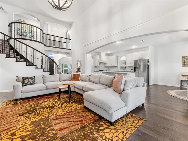 a living room with furniture and a rug