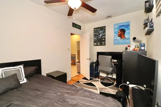 a view of a workspace with furniture and gym equipment