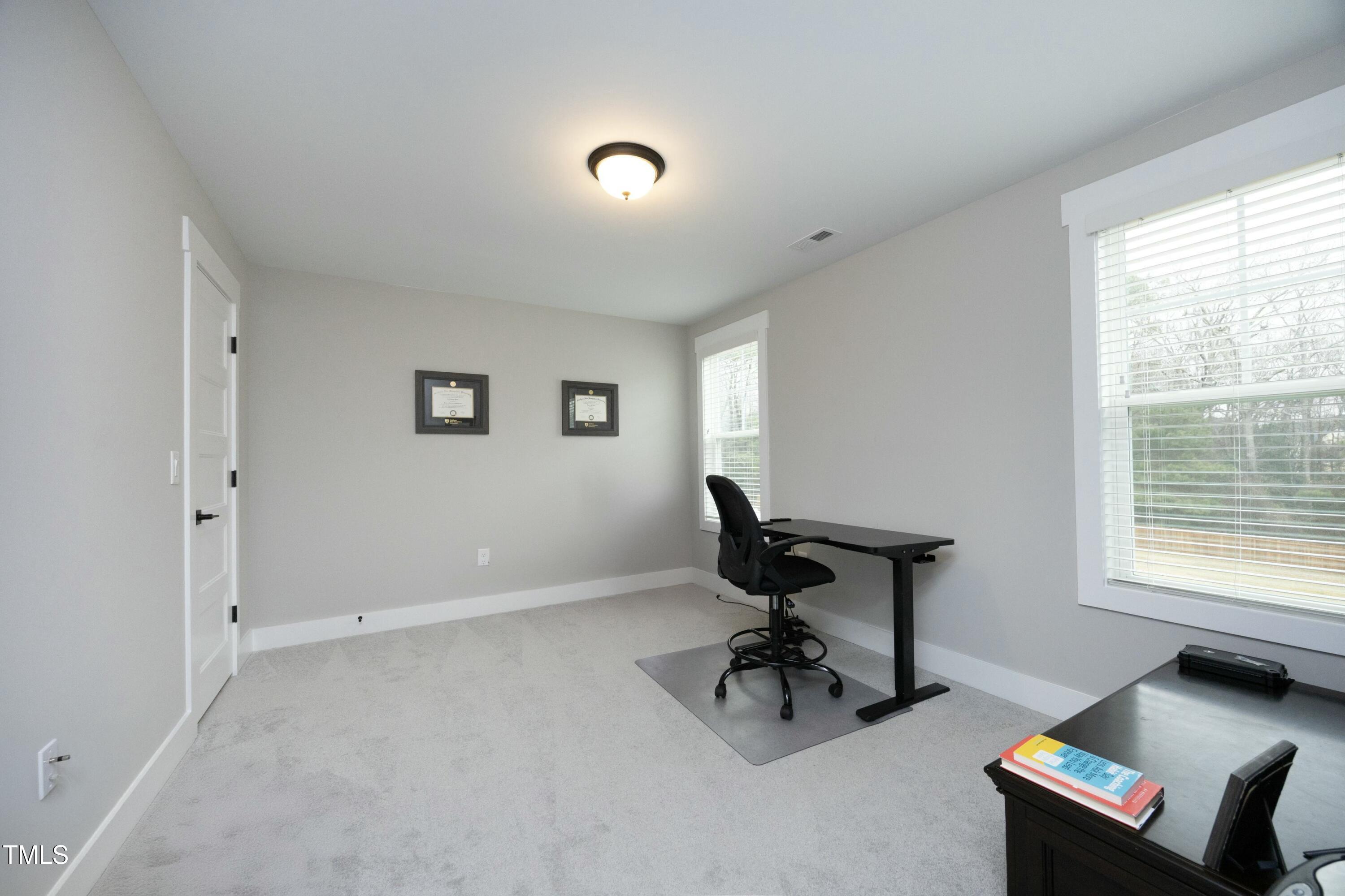 97 Buckstone Place Willow Spring, NC 27592 - Photo 27 of 33 a view of a workspace with a window