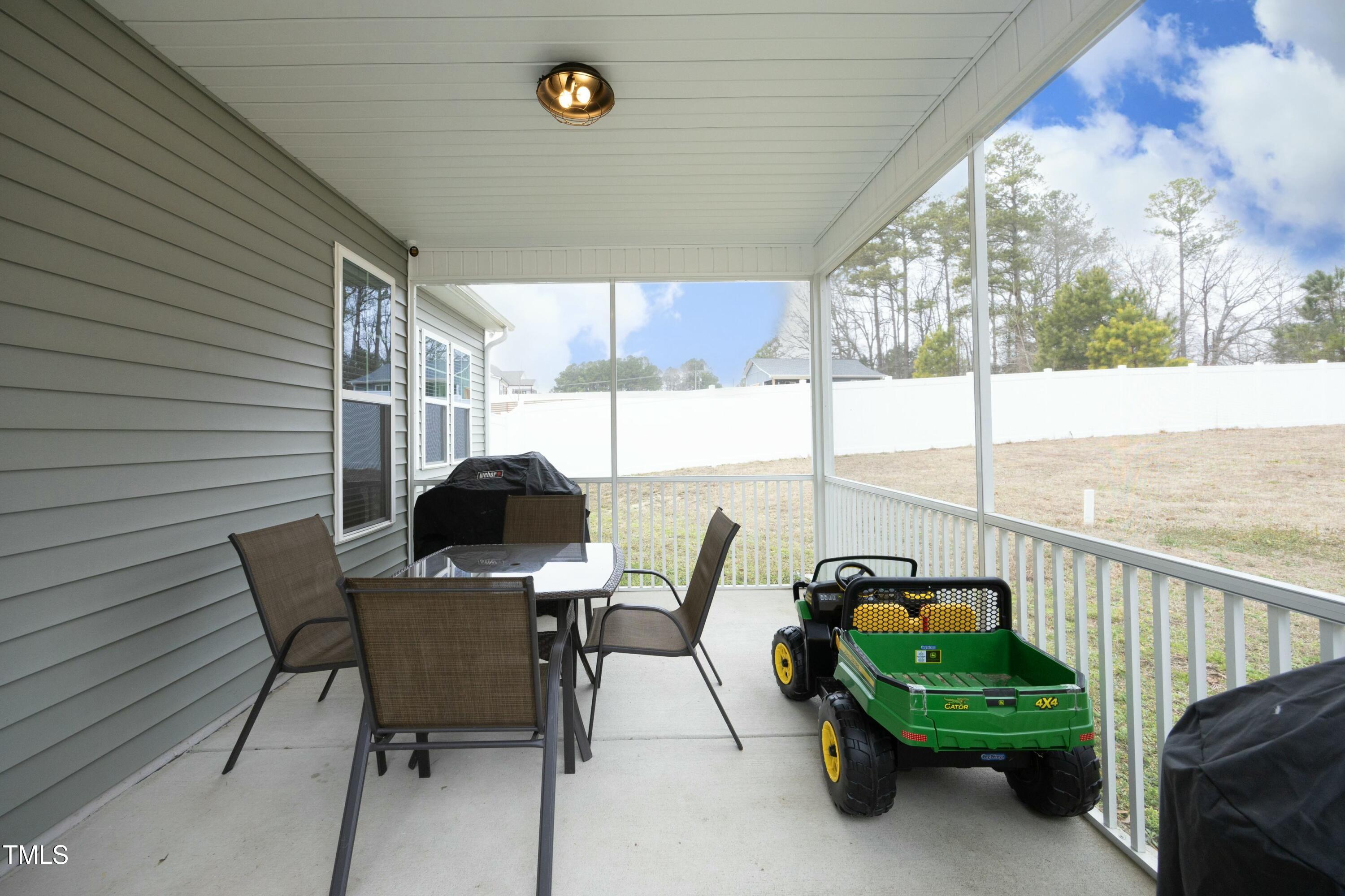 97 Buckstone Place Willow Spring, NC 27592 - Photo 29 of 33 a view of a chairs and table in the balcony