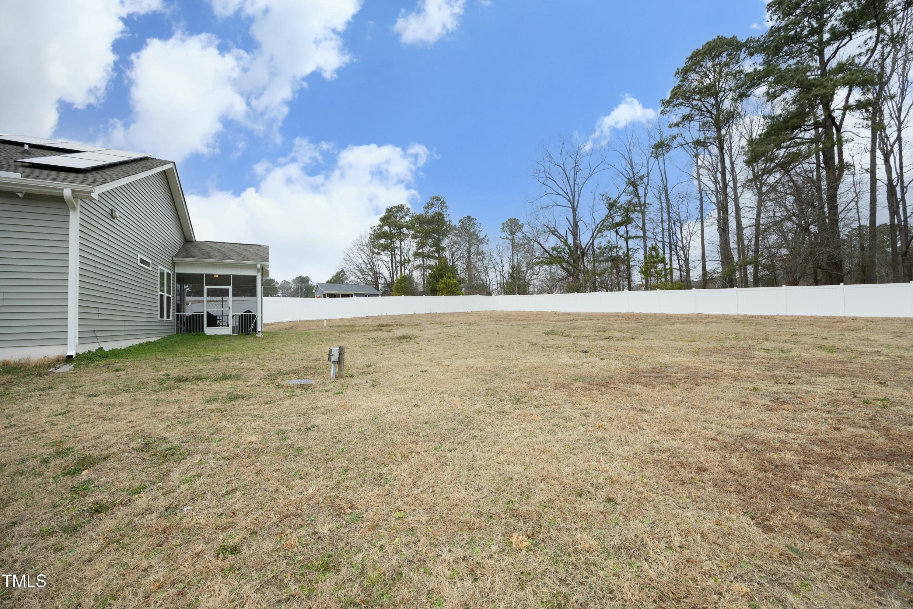 97 Buckstone Place Willow Spring, NC 27592 - Photo 31 of 33 a view of a yard with a house