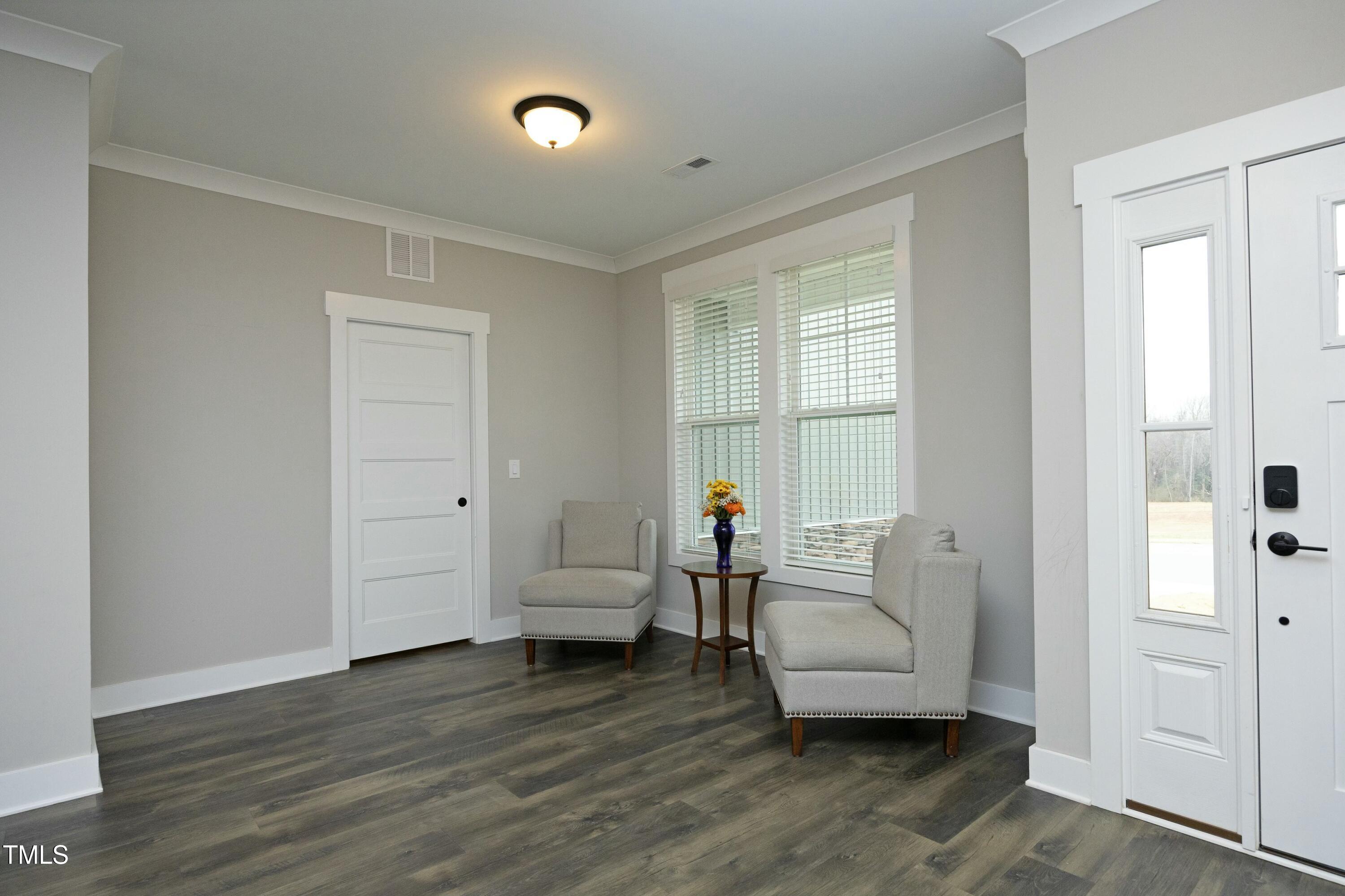 97 Buckstone Place Willow Spring, NC 27592 - Photo 4 of 33 a living room with furniture and wooden floor