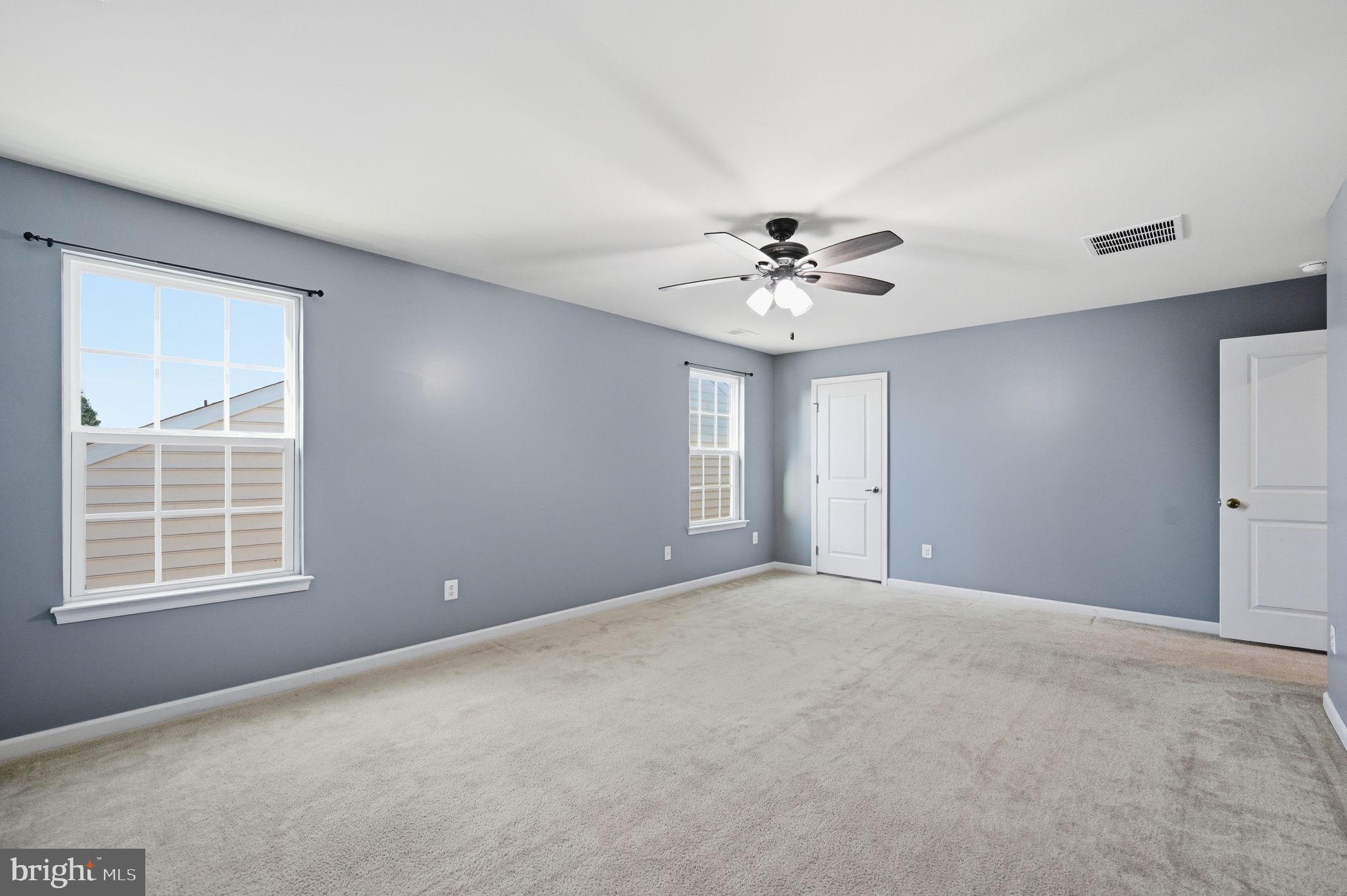 687 Blossom Tree Road Culpeper, VA 22701 - Photo 20 of 31 a view of an empty room with windows