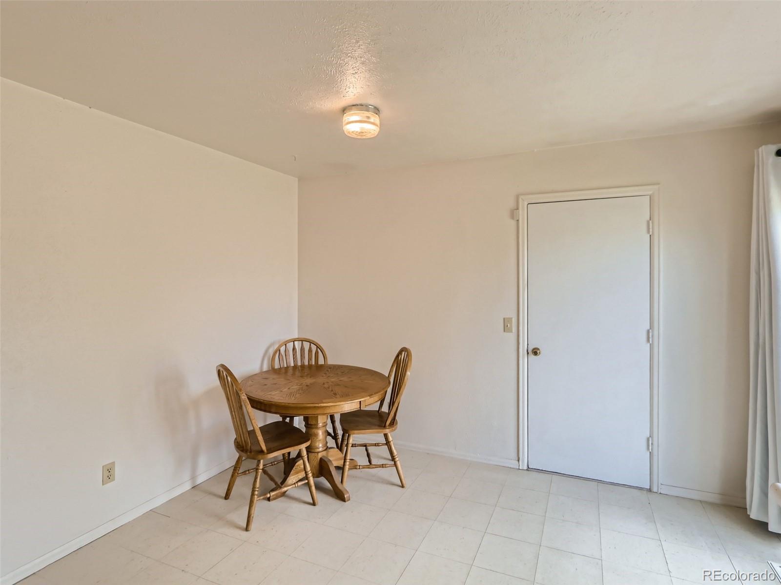 1632 South Rifle Street Aurora, CO 80017 - Photo 12 of 26 a view of a room with a table and chairs