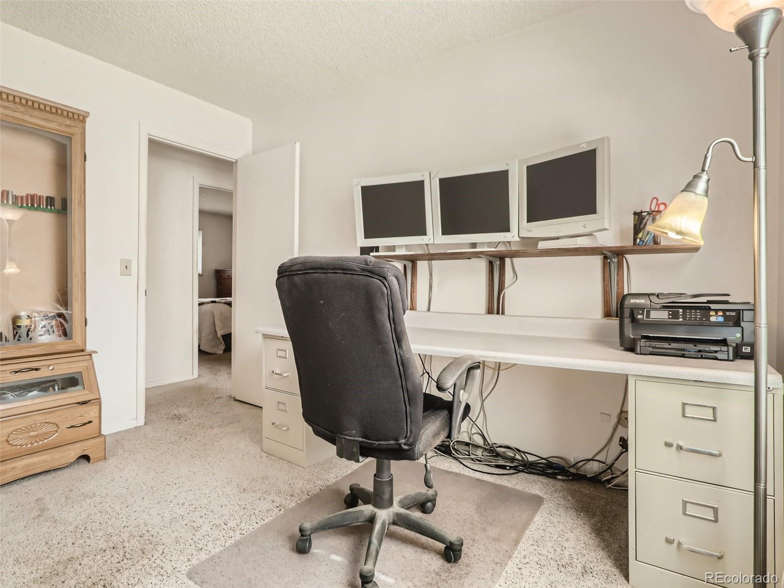 1632 South Rifle Street Aurora, CO 80017 - Photo 16 of 26 a view of a workspace with furniture