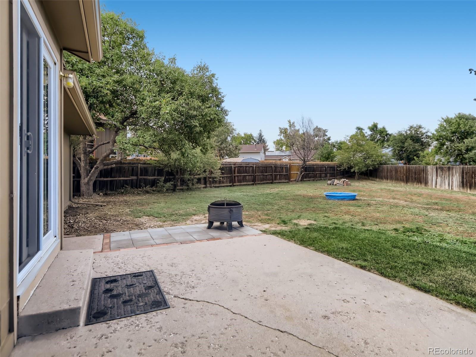 1632 South Rifle Street Aurora, CO 80017 - Photo 22 of 26 a view of a park with bench in a patio