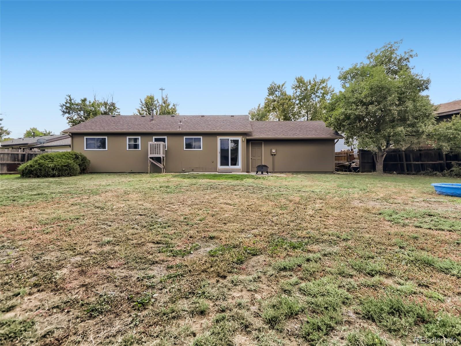 1632 South Rifle Street Aurora, CO 80017 - Photo 25 of 26 a house that has a tree in front of it