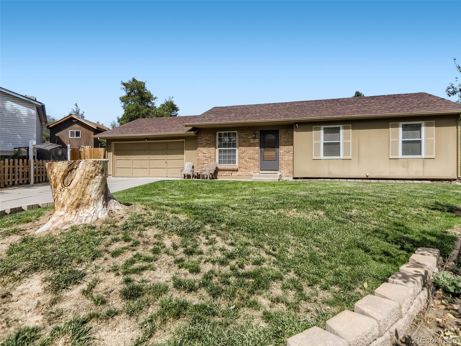 1632 South Rifle Street Aurora, CO 80017 - Photo 3 of 26 a front view of a house with garden