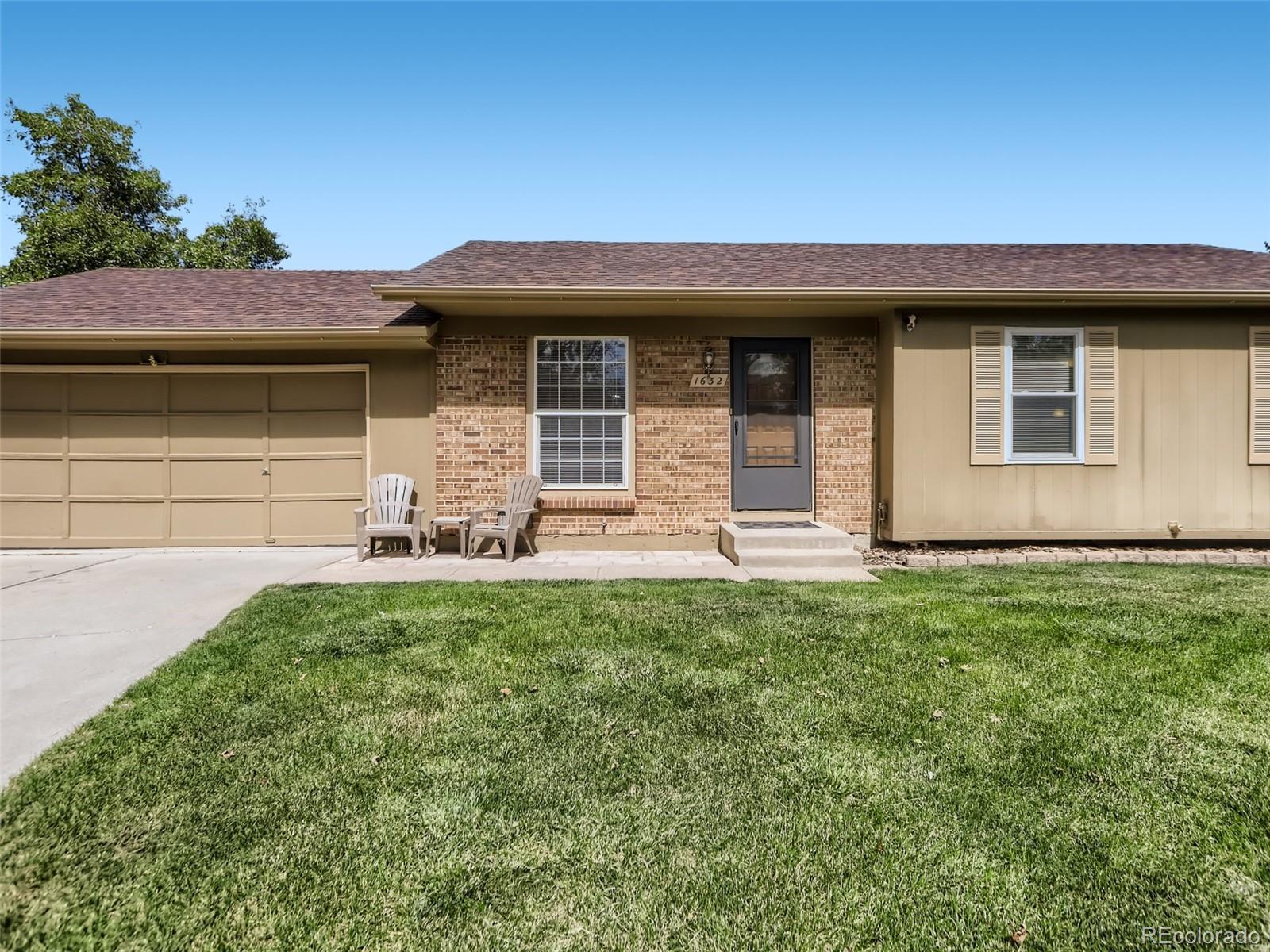 1632 South Rifle Street Aurora, CO 80017 - Photo 4 of 26 a front view of a house with garden