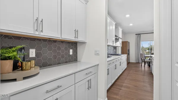 a kitchen with stainless steel appliances a sink stove and refrigerator
