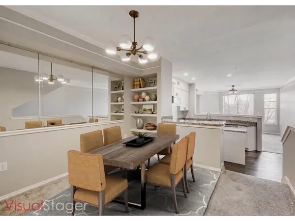 a kitchen with kitchen island granite countertop a sink stove and refrigerator